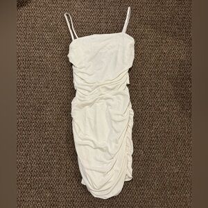 Formal dress, tight with ruffles,looks weird until it is on,very beautiful dress